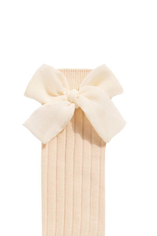 Beige knee socks for a girl with a beige bow