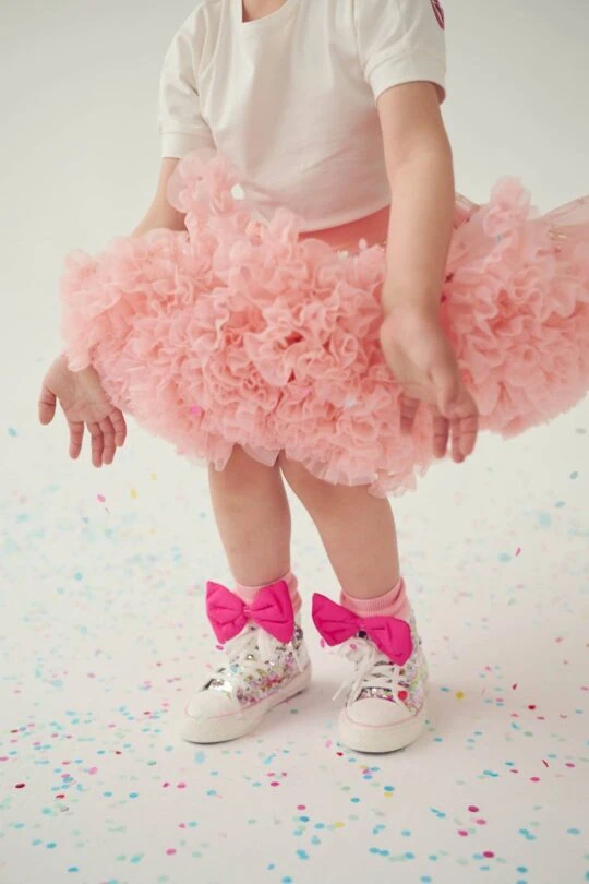 Playing girl in pink tulle skirt Fig