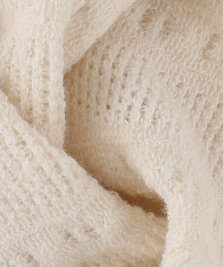 Collant traforati crema per bambina, morbidi e leggeri con dettaglio di fiocco in tulle.